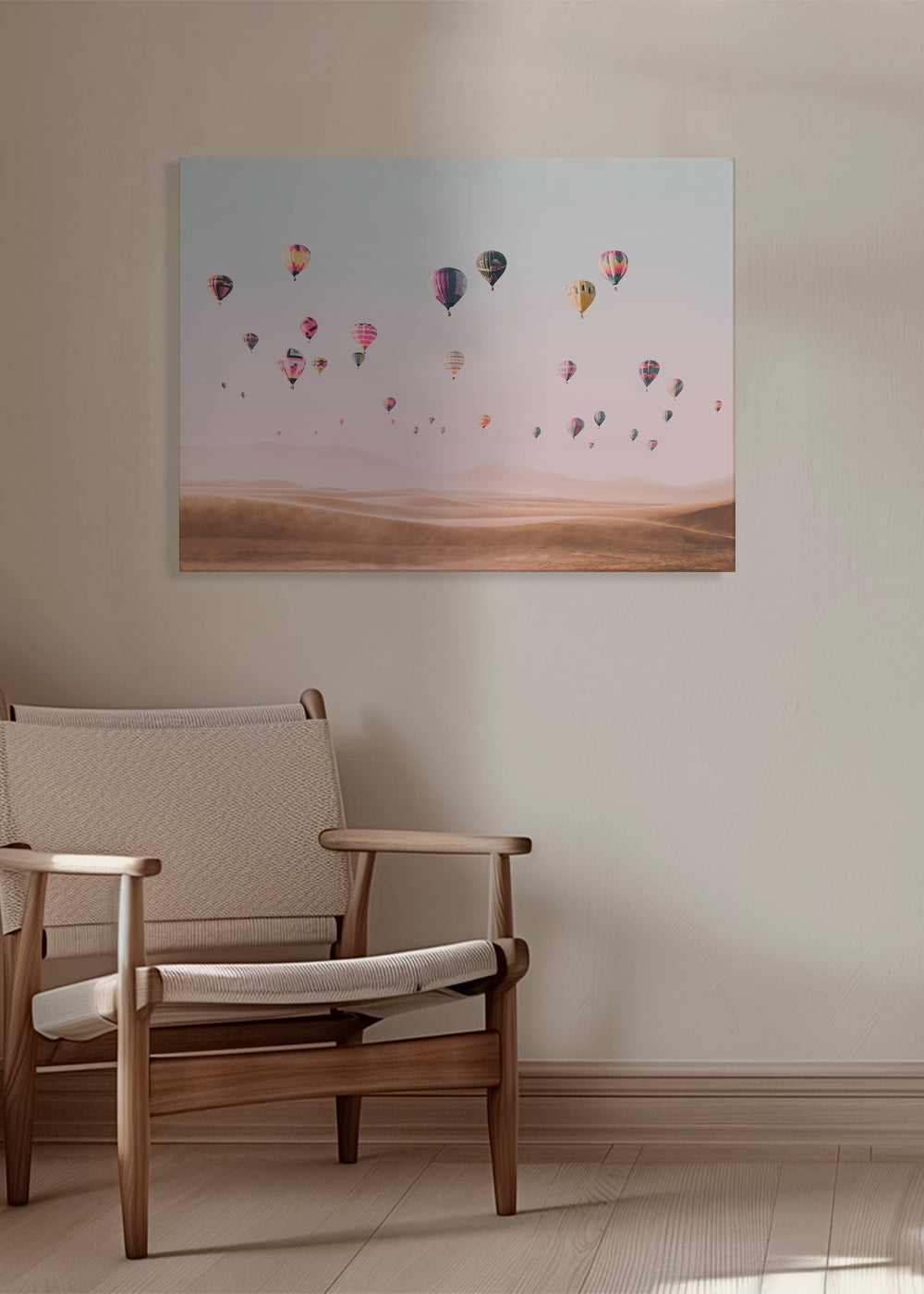 Landskap med luftballonger över sanddyner