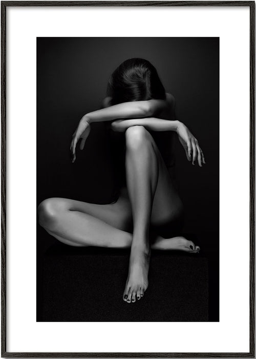 Fotografi av sittande figur i studio