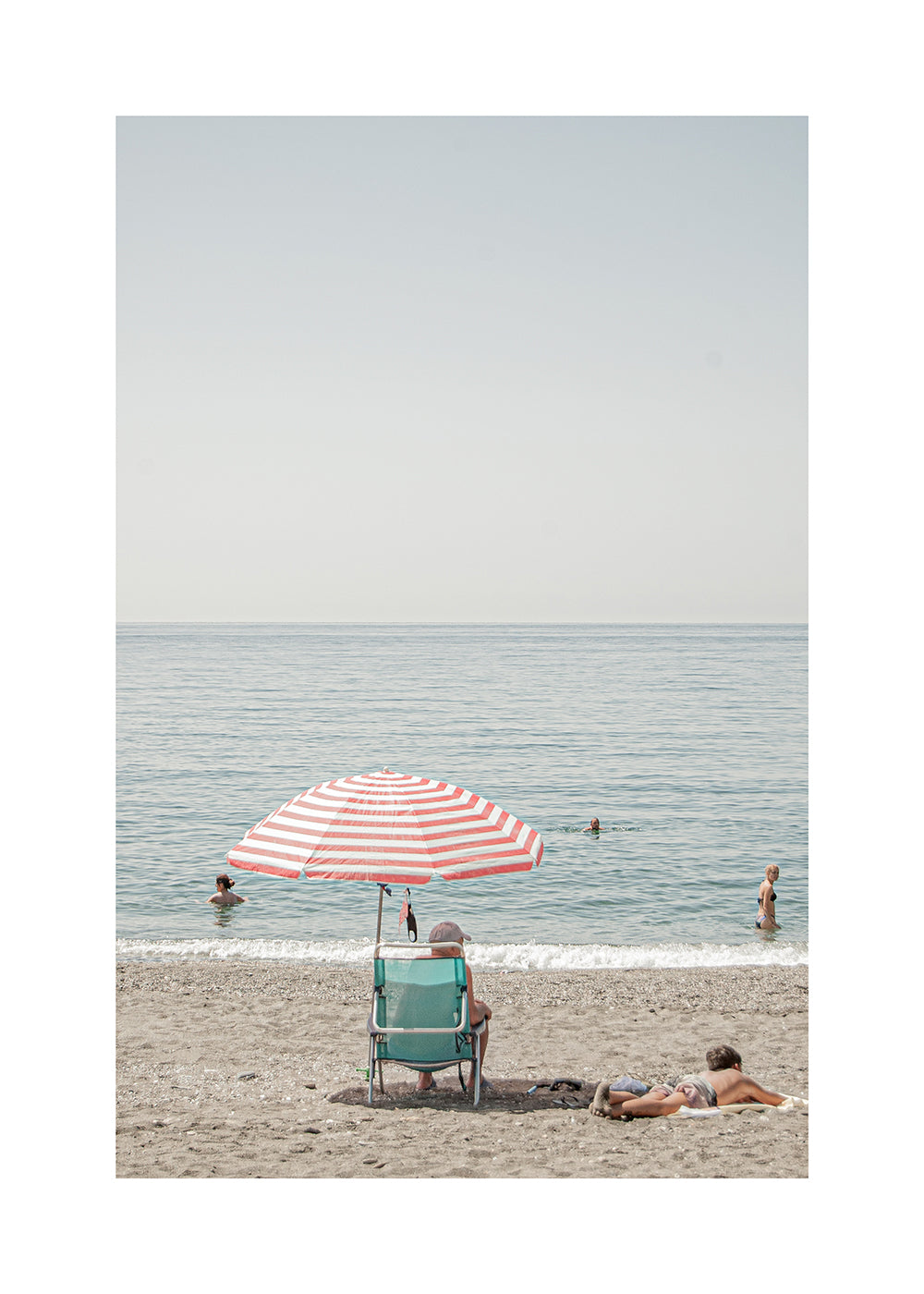 Landskapskonst: parasoll vid stranden