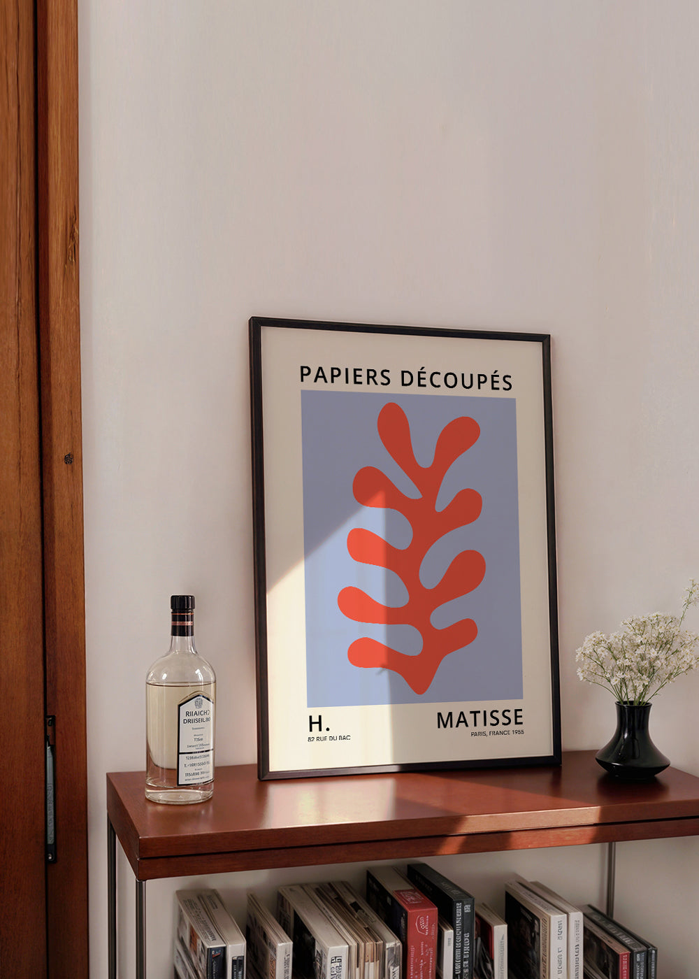 Botanisk plansch Matisse-stil: rött blad mot blå bakgrund