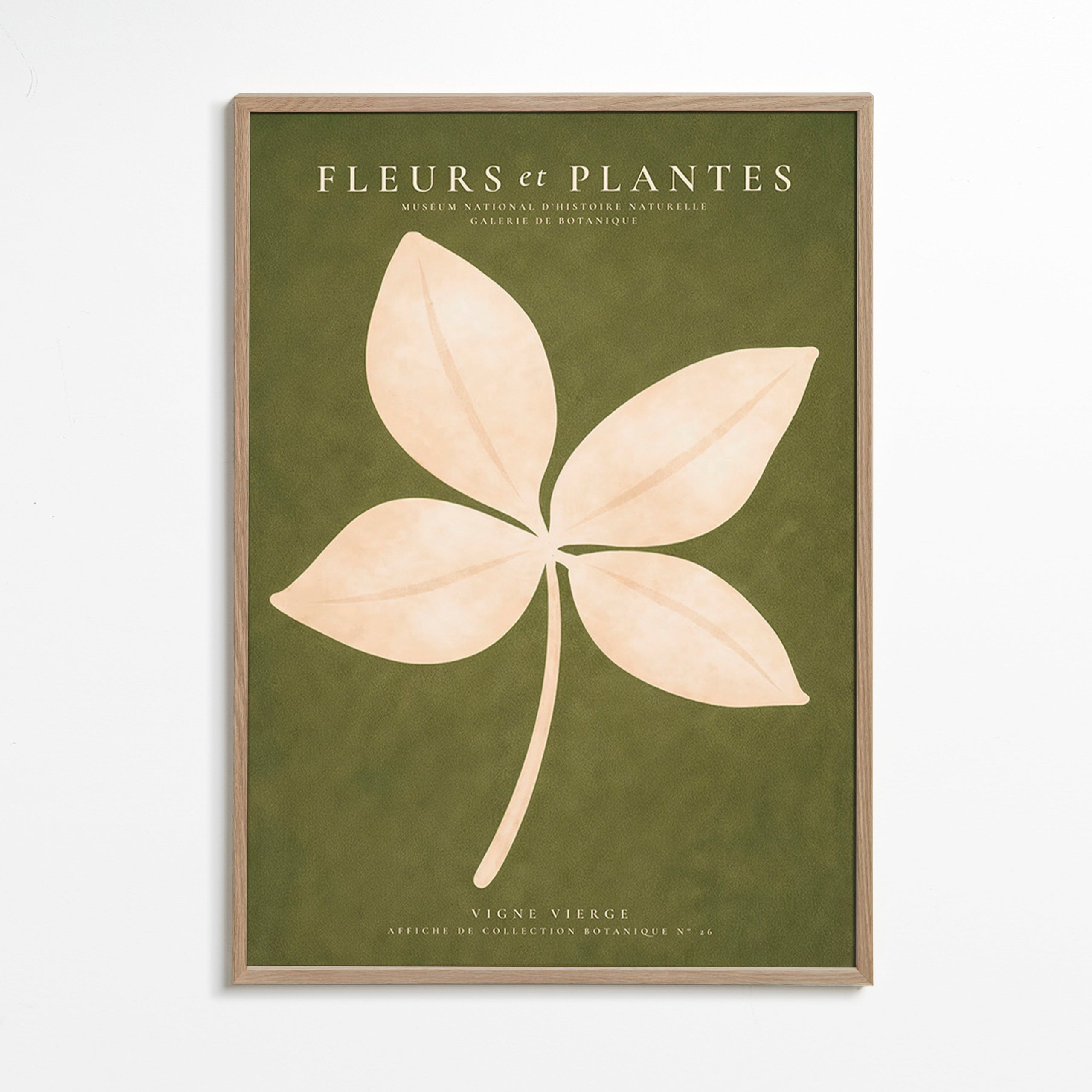 Botanisk print: krämfärgat blad mot grönt fält