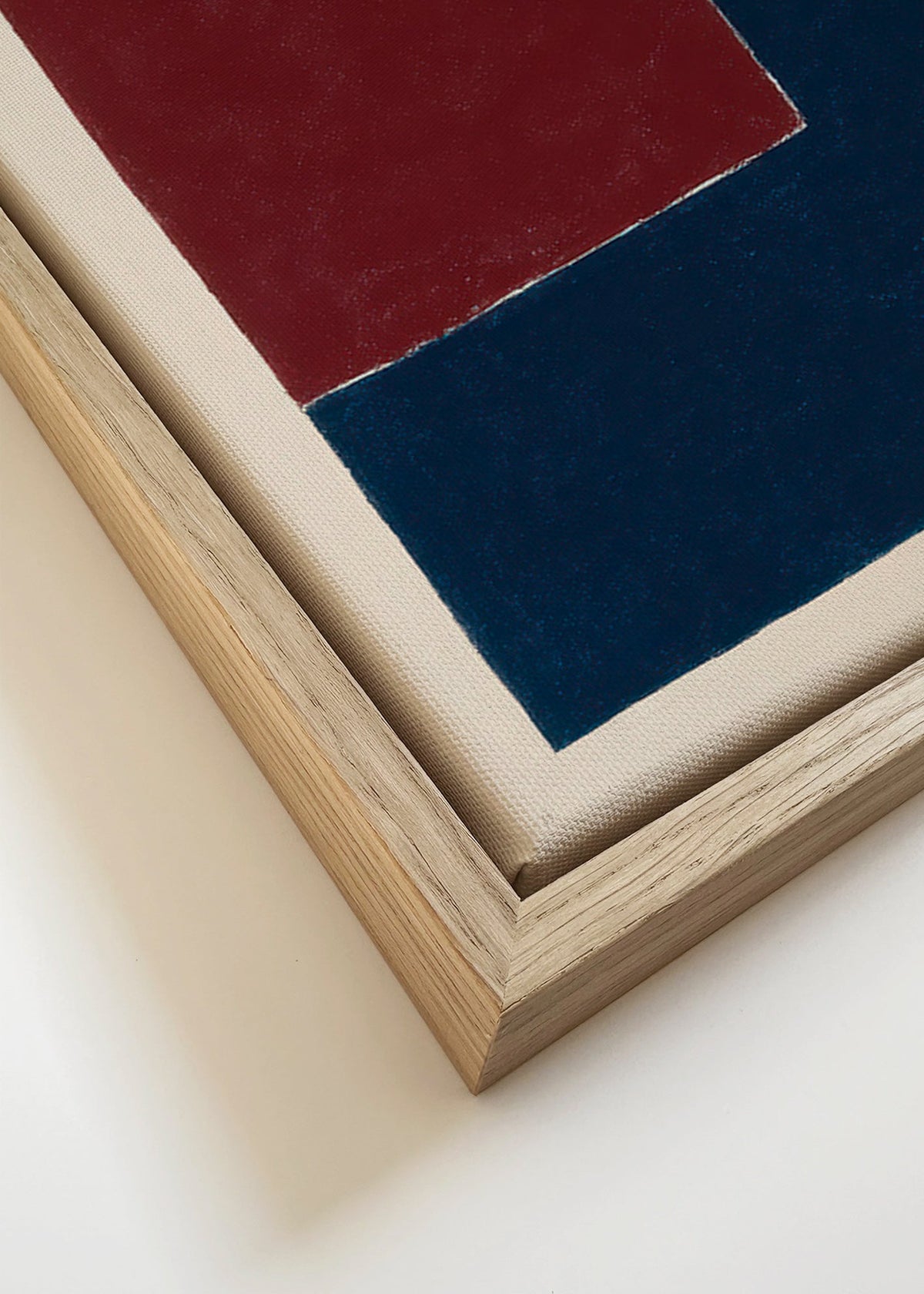 Geometrisk tavla med djupblå och bordeauxfärgade block – Canvas detail