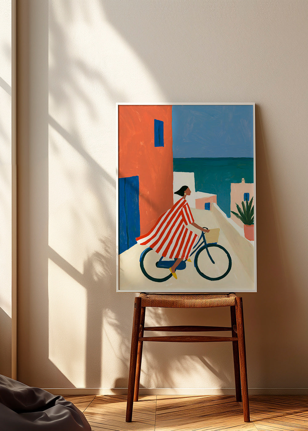 Landskapskonst med cyklist vid havet