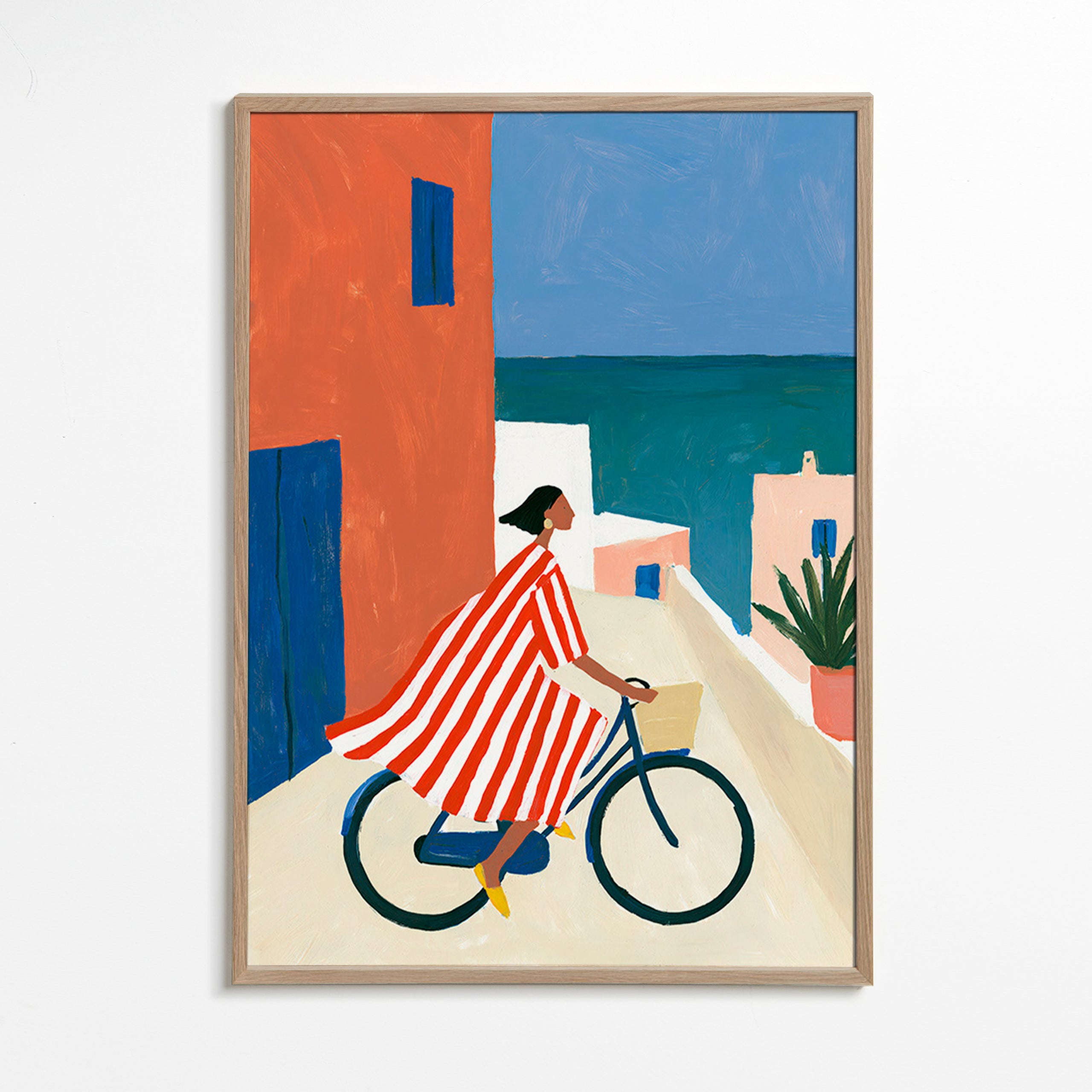 Landskapskonst med cyklist vid havet