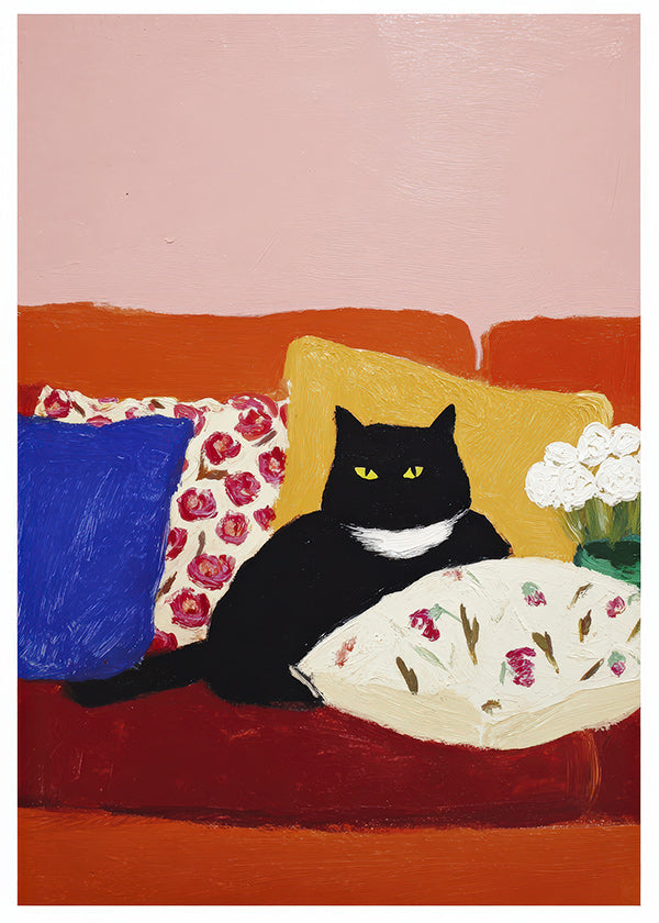Konstverk svart katt på färgglad soffa