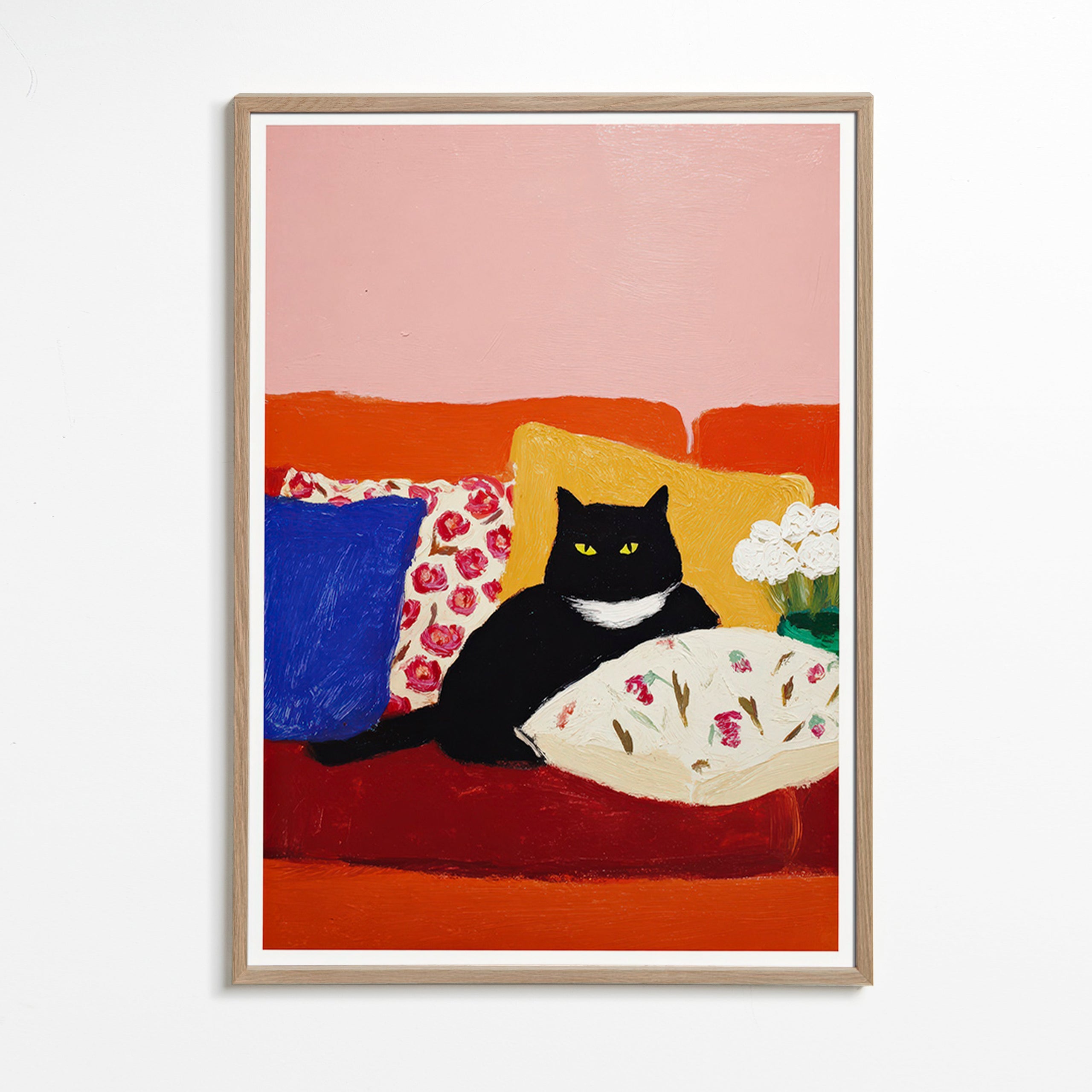 Konstverk svart katt på färgglad soffa
