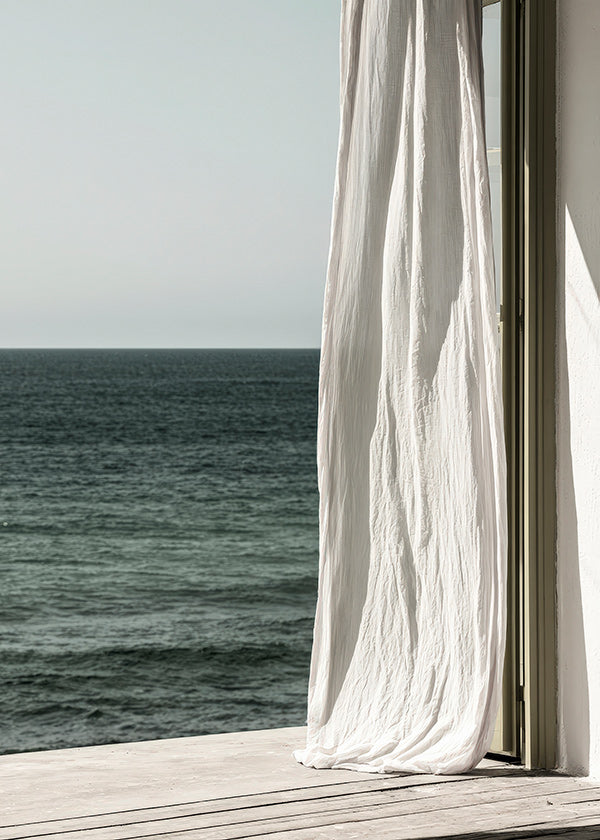 Landskapskonst med gardin vid havet